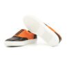 Hazelwood lage sneaker in de kleuren oranje en zwart met een witte visgraat sneakerzool