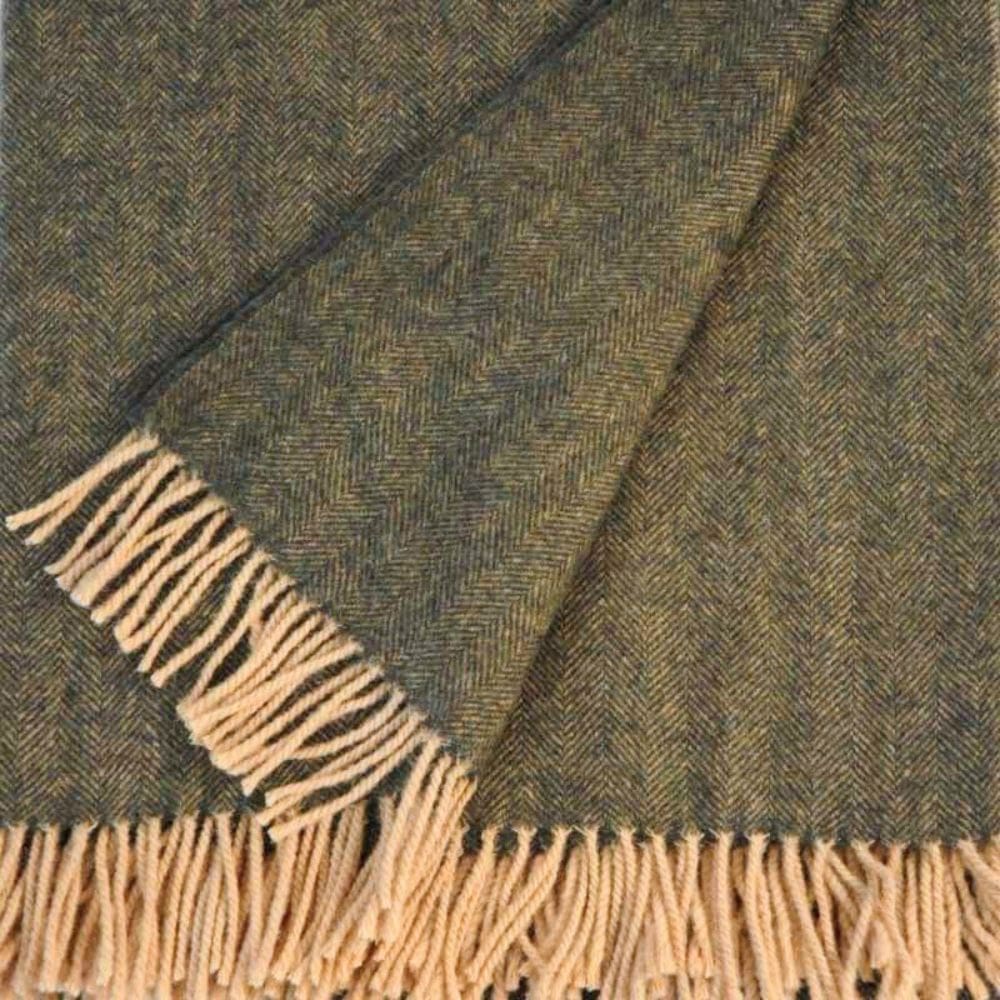 Stof detail van de lamswollen kaki poncho